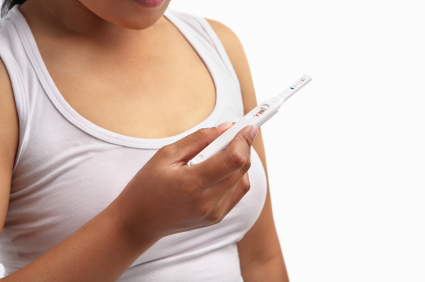 womanholdingpregnancytest.jpg womanholdingpregnancytest.jpg